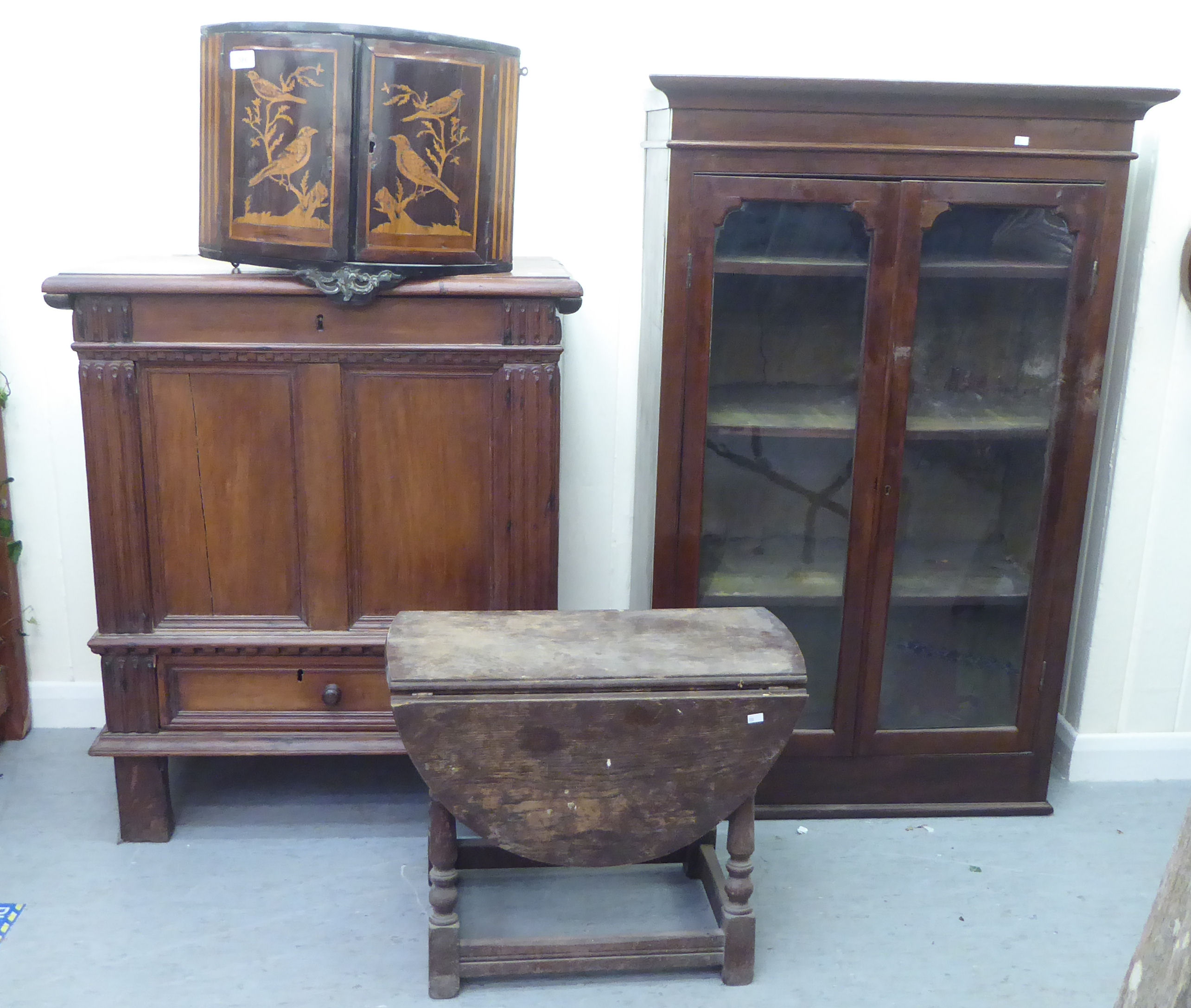 Small furniture: to include a late 18thC marquetry hanging corner cupboard with two doors, decorated