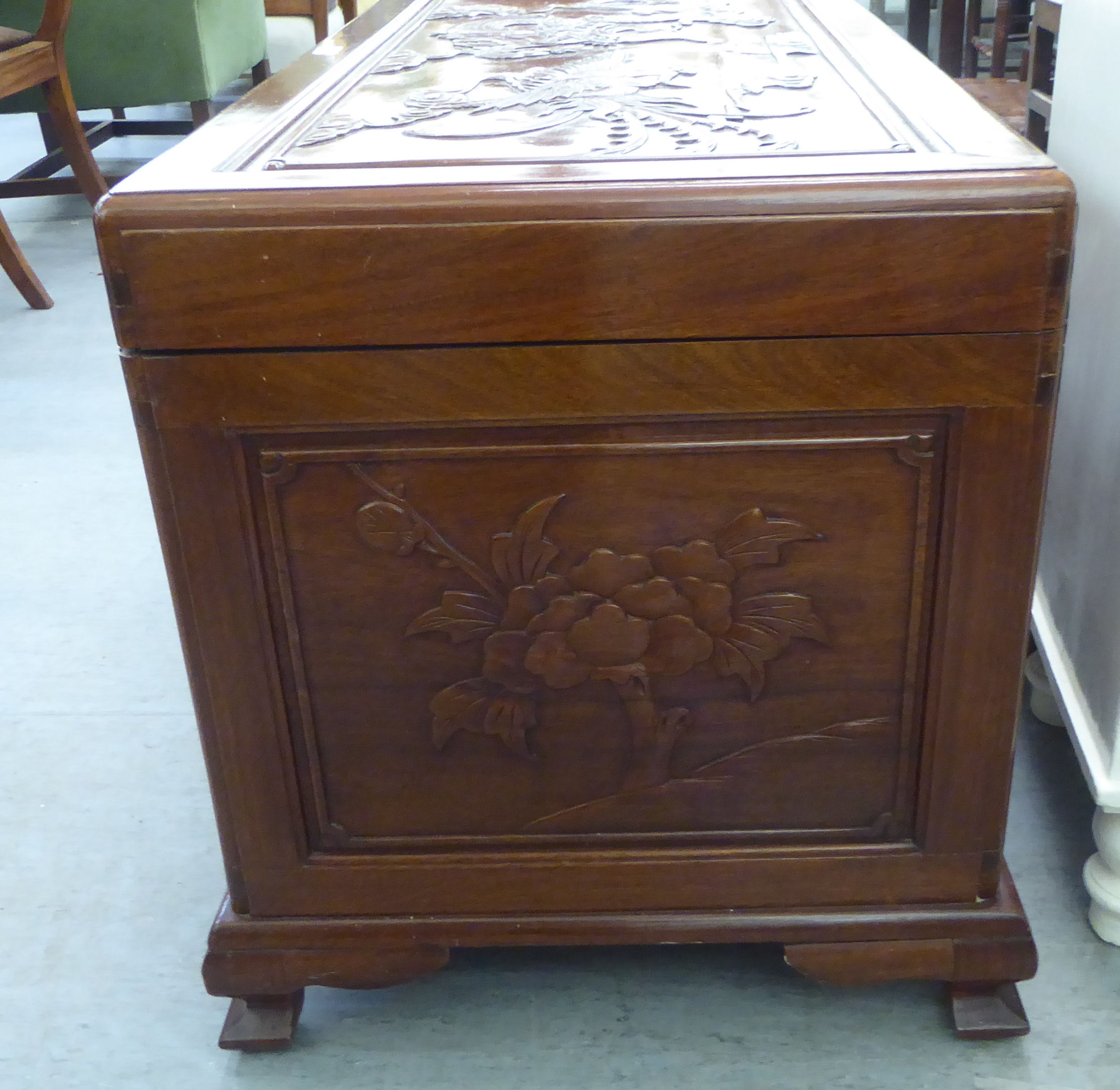 A mid 20thC Chinese fruitwood chest, allover carved with dragons, raised on bracket feet  24"h  41"w - Image 4 of 4