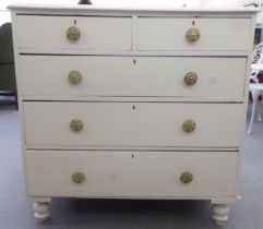 A late Victorian painted pine dressing chest with two short/three long drawers, raised on turned