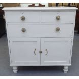 A late Victorian painted pine cabinet with two short/one long drawer, raised on turned legs  38"h
