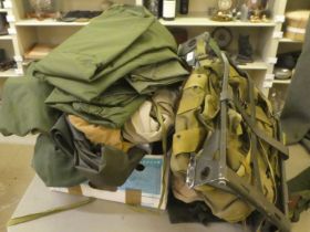Military uniform accessories: to include two rucksack frames; trousers; waterproofs; and other