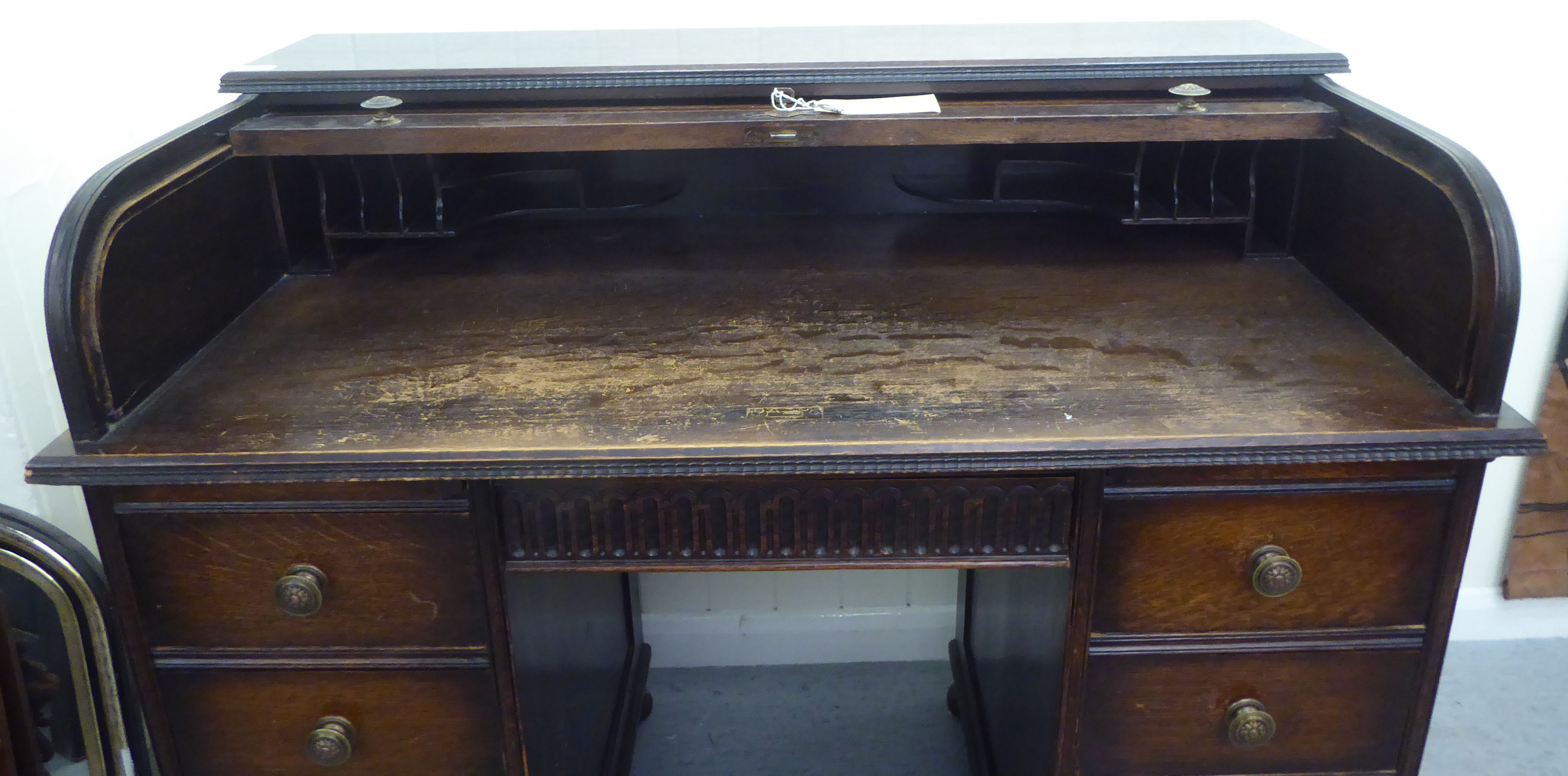 A 1930s oak roll top desk with twin pedestals, comprising an arrangement of eight drawers, raised on - Image 2 of 4