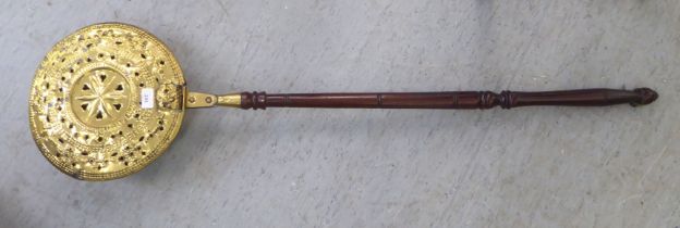 A late 18thC brass bed warming pan, on a turned fruitwood handle  50"L