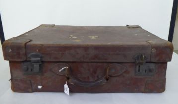 An early 20thC gentleman's brown hide travelling case  stamped 'Tom Hill, Actual Maker, Sloane