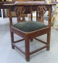 A George III oak corner chair with a double splat back and drop-in seat, raised on square legs