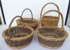 Four woven cane baskets  largest 17"h  13"dia