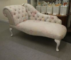 A modern Edwardian style nursery size, chaise longue, decorated in floral patterned, white and