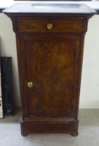 A late 19thC Continental walnut pedestal pot cupboard with a black slate top, over a cushion moulded