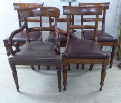 A set of four late Regency mahogany framed, curved bar back dining chairs with upholstered seat