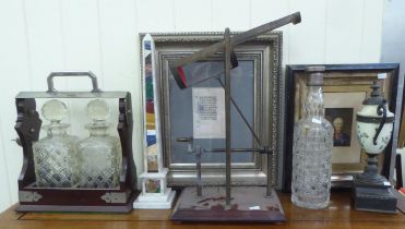 A mixed lot: to include an early 20thC mahogany and silver plated tantalus with two glass decanters