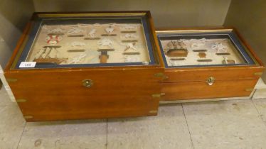 Two brass bound glazed, mahogany boxes, containing nautical knots and model boats  largest 8"h  16"w