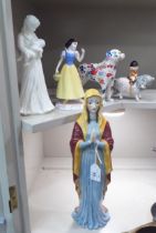 Ceramic figures: to include a Beswick example, 'The Virgin Mary'  14"h; and an example by Royal