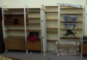 A Ladderax style modular wall unit with teak shelves, cabinets and white painted metal frames,