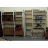 A Ladderax style modular wall unit with teak shelves, cabinets and white painted metal frames,