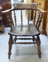 A late 19th/early 20thC beech and oak captains desk chair  bears reference to one Captain Terrick of