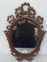 A 20thC Victorian style mirror, the oval plate set in a ribbon moulded gilt frame  19" x 12"