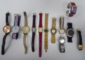 Twelve modern variously strapped wristwatches of differing styles and designs: to include Daniel