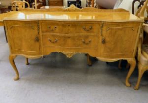 A modern bleached walnut serpentine front sideboard with an arrangement of two drawers/two doors,
