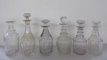 19thC glass decanters: to include one of wrythen moulded design with a stopper and another etched '