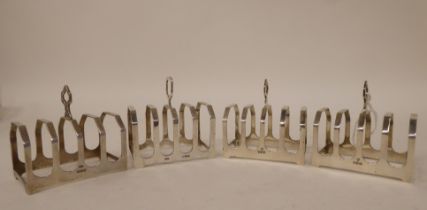 Four similar silver four division toast racks  mixed marks  (combined weight approx. 5ozs)