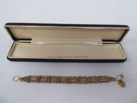 A 9ct gold fancy gate link bracelet, on a padlock clasp and safety chain  boxed