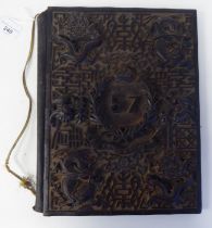 A Victorian hardwood folio, the front cover finely carved in relief with the emblem of The 57th