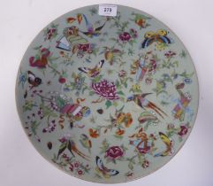 A 19thC Chinese celadon glazed, footed porcelain dish, decorated with small artefacts, songbirds,