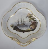 An early 19thC David Wilson earthenware shell shape dish, depicting a ship-of-the-line, the border