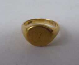 An 18ct gold signet ring, bears a monogram