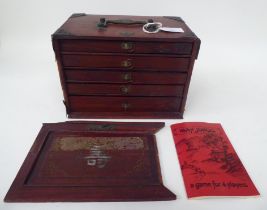 A Mah Jong set with engraved bone sticks and tiles  (completeness not guaranteed) contained in a
