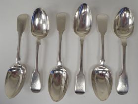 A matched set of six Victorian silver fiddle pattern dessert spoons  mixed marks  (combined weight