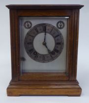 A late 19th/early 20thC mahogany cased cube design mantel clock with straight sides and bevelled