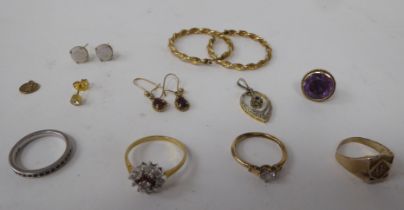 Yellow and gold coloured metal jewellery: to include hoop earrings; a seal pendant; and a claw set