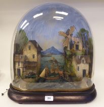 A 19thC diorama automaton, featuring a rock in the sea and in the foreground a water wheel, windmill