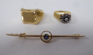 Gold coloured metal items of personal ornament, viz. a French signet ring; an 18ct part textured