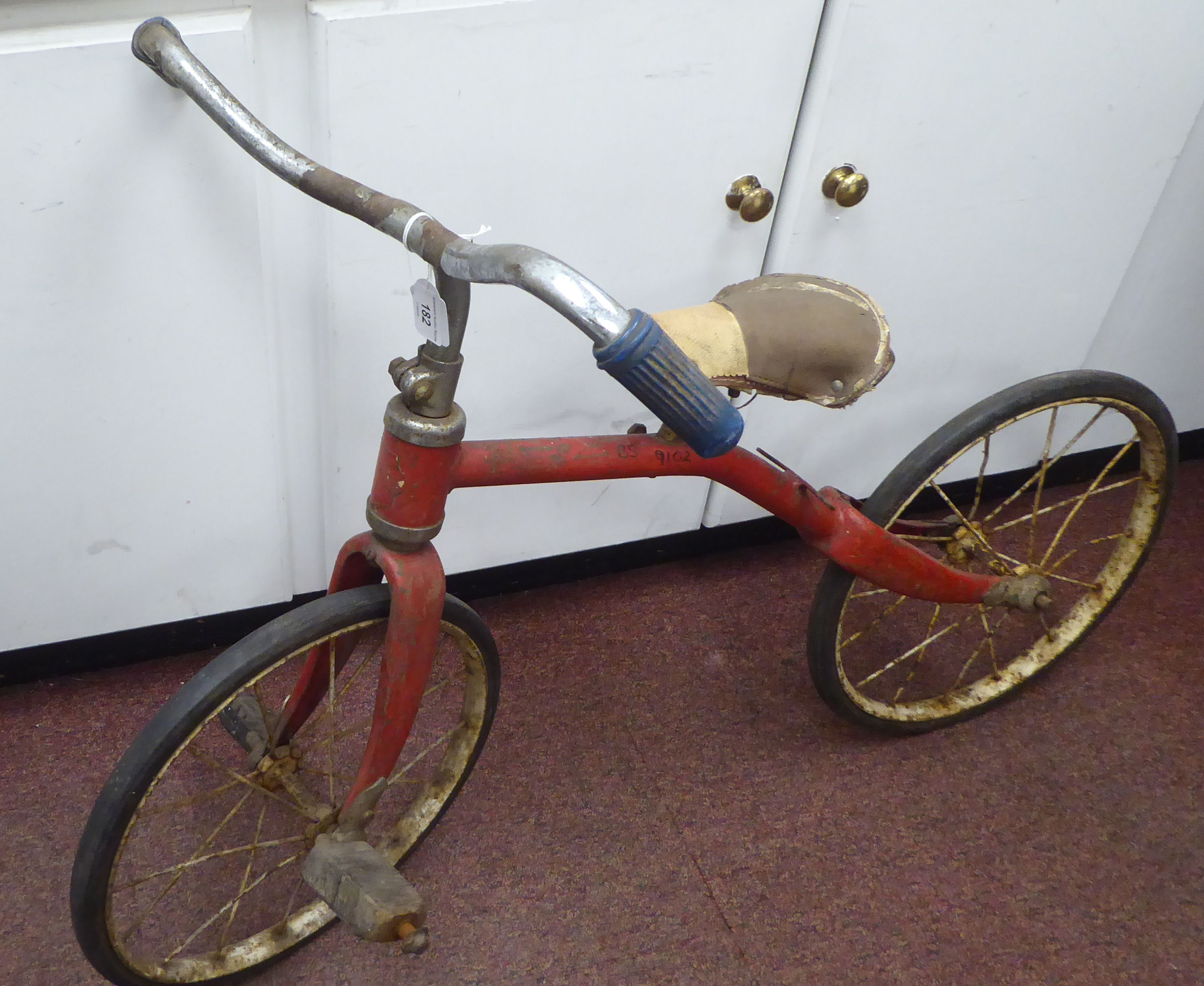 A child's vintage Tri-ang bicycle with a red painted frame and downswept handlebars, the pedals - Image 2 of 7
