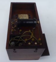 A vintage Watson & Sons (Electro Medical Ltd) shock treatment instrument, fitted in a mahogany box