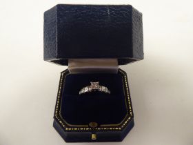A platinum and diamond set ring  boxed