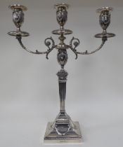 An Edwardian loaded silver two part table candelabrum of Neo Classical design, comprising three vase