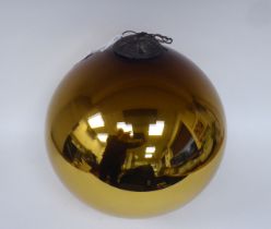 A bronze coloured glass witches ball with a pendant connection  12"dia