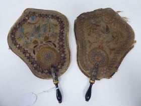 A pair of late 18th/early 19thC embroidered silk cartel shape, handheld face screens, decorated with