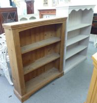 A shabby-chic painted pine open front bookcase  48"h  36"w; and a waxed pine example  42"h  36"w