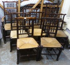 A matched set of eight 18thC Lancashire ash framed spindle back dining chairs with woven rush seats,