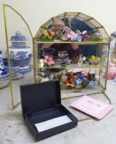 A set of fourteen Franklin Mint 'Butterflies of the World' porcelain sculptures, in a glass