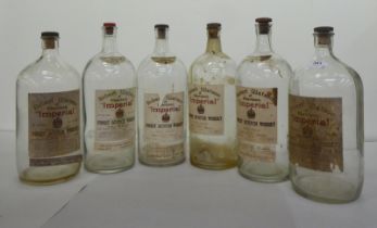 Six empty Robert Watson of Aberdeen 'Imperial' whisky bottles  12.5"h