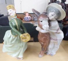 A Lladro porcelain group, a young boy beside a donkey  8"h; and a Royal Doulton china figure 'Grace'