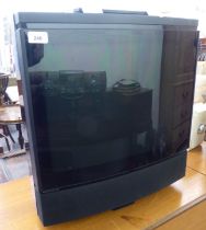 A Bang & Olufsen 22" television with remote control