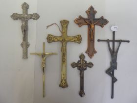 Six cast metal crucifixes  varying designs & sizes  largest 16"h