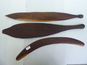 Aboriginal wooden tools, viz. two Woomera spear throwers  18" & 29"L; and a boomerang  24"L