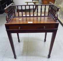 A modern yew finished bedside table with a galleried top, over a shallow drawer, raised on square,